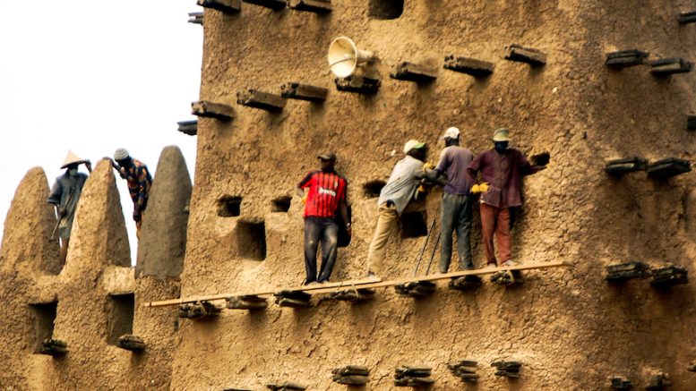 The facade of the Djenné mosque needs repairing every year. The climate change has definitely worsened the process of loss. Photo credit: Ralf Steinberger