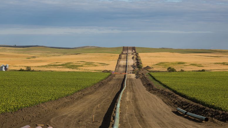 A pipeline installation between farms, as seen from 50th Avenue in New Salem, North Dakota.
